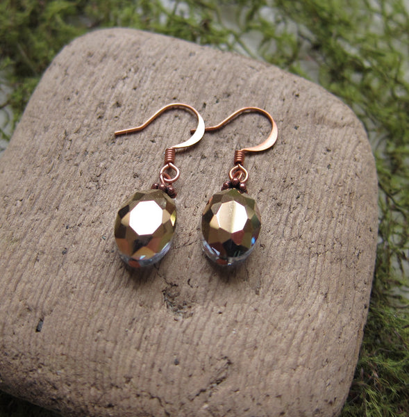 Sold. Copper and sage green earrings, a light green crystal in the circle beading hung from copper ear wires. selling