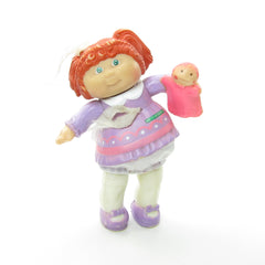 Cabbage Patch Kids poseable figure girl with red hair and purple dress